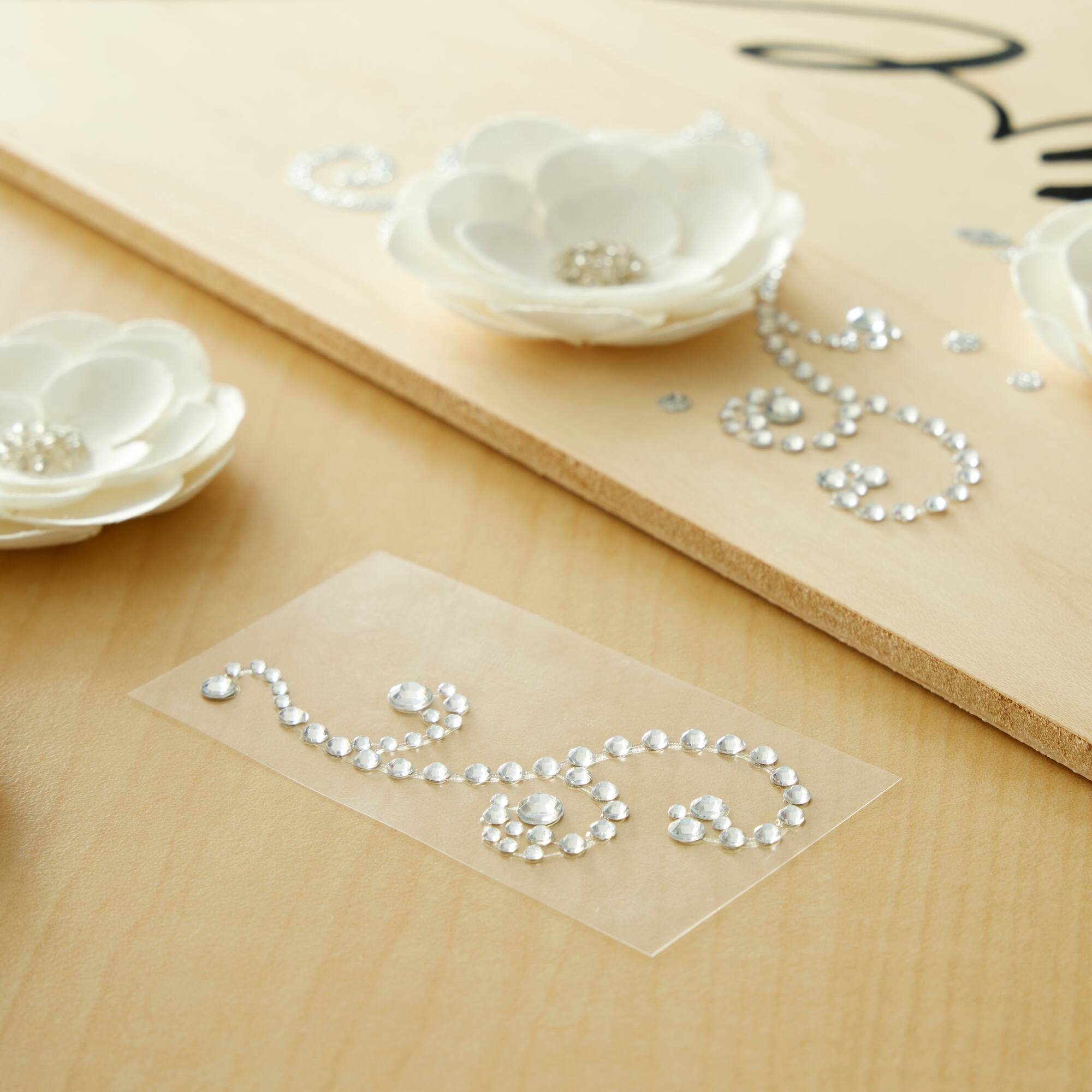 12 Packs: 4 ct. (48 total) Clear Swirl Flourish Adhesive Rhinestones by Recollections™